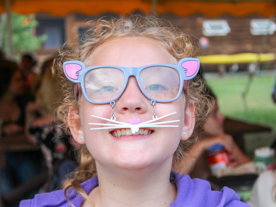 Camper smiling with funny glasses