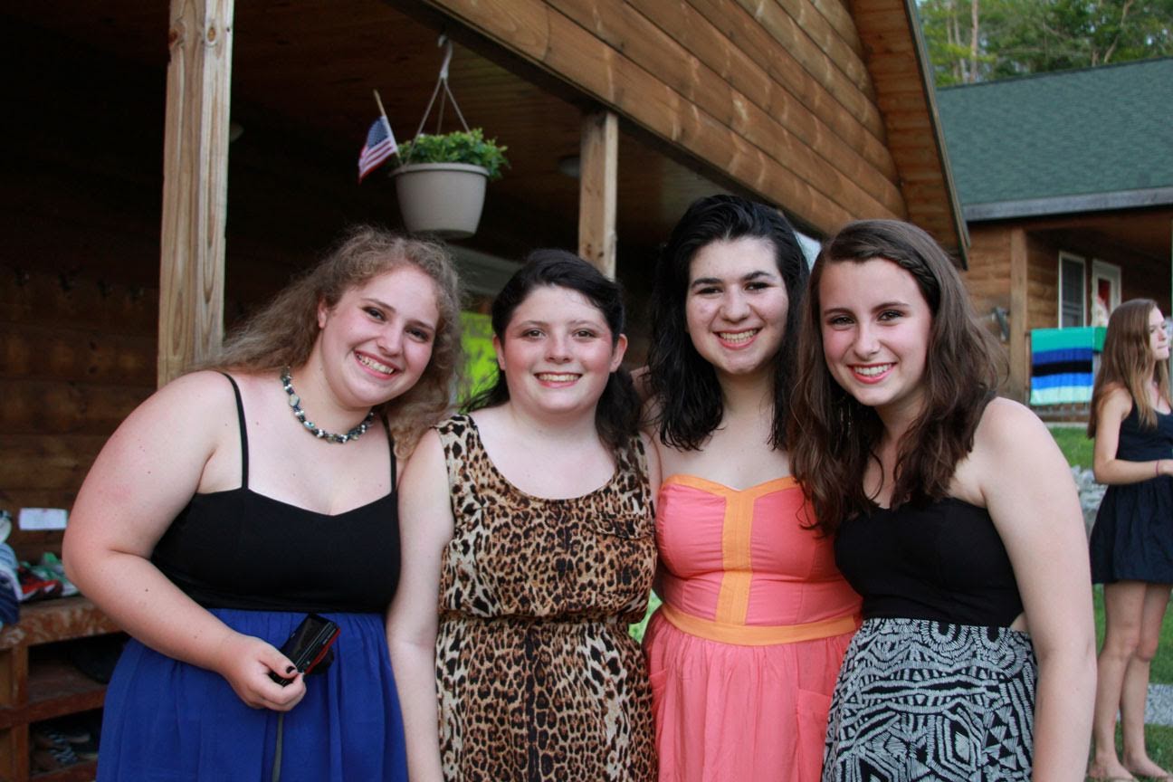 A group of campers is ready to go to the dance.