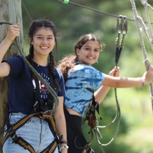 Campers on a high ropes course